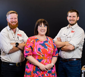 Photo of Red Bolt team members standing together.